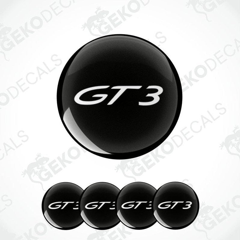 Set of four black and white vinyl decals with the GT3 logo, designed for use on car wheel caps.