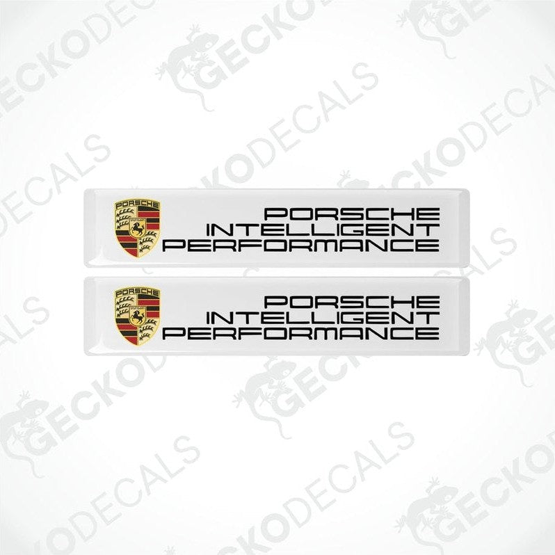 Two withe vinyl stickers with the PORSCHE logo.
