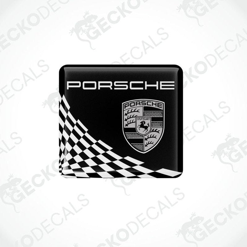 Black, white, and gold Porsche branded vinyl stickers with a checkered pattern.