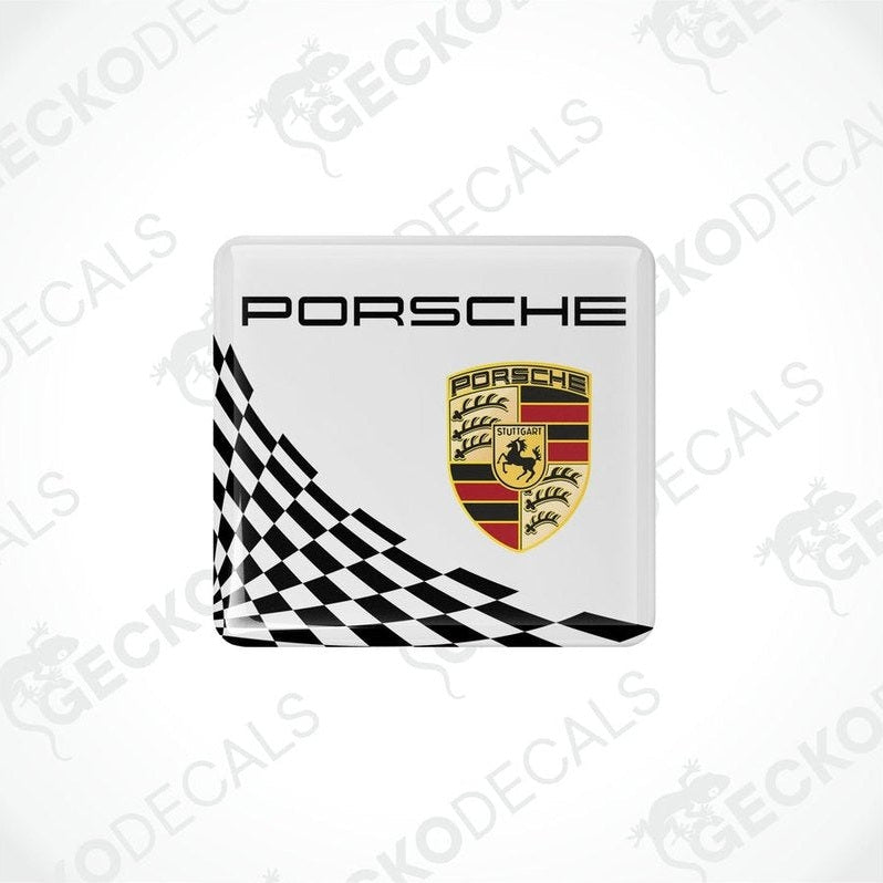 White,black and gold Porsche branded vinyl stickers with a checkered pattern.