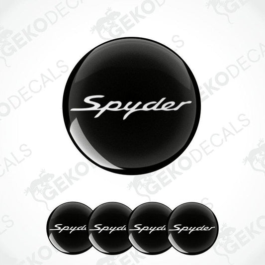 A set of four black vinyl stickers with the word 'Spyder' branded on them, designed for use as car decals.