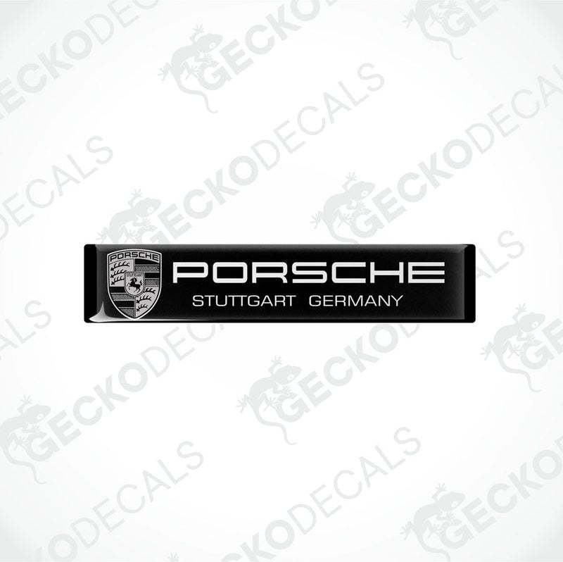 Black rectangular vinyl decals with the text 'PORSCHE STUTTGART GERMANY' on them, placed on a white background.