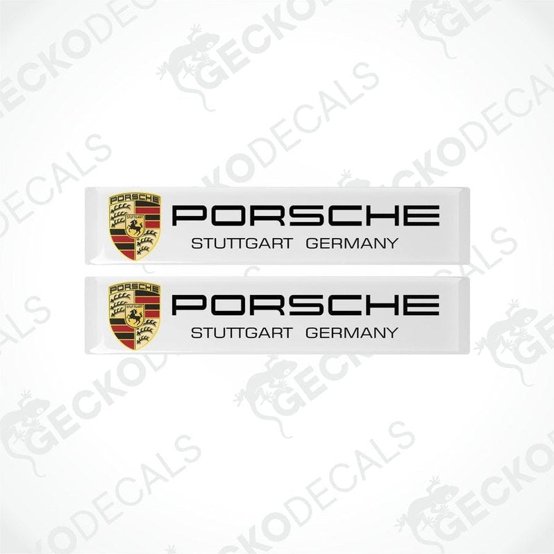 Two withe vinyl stickers with the Porsche brand logo and the text 'Stuttgart Germany'.