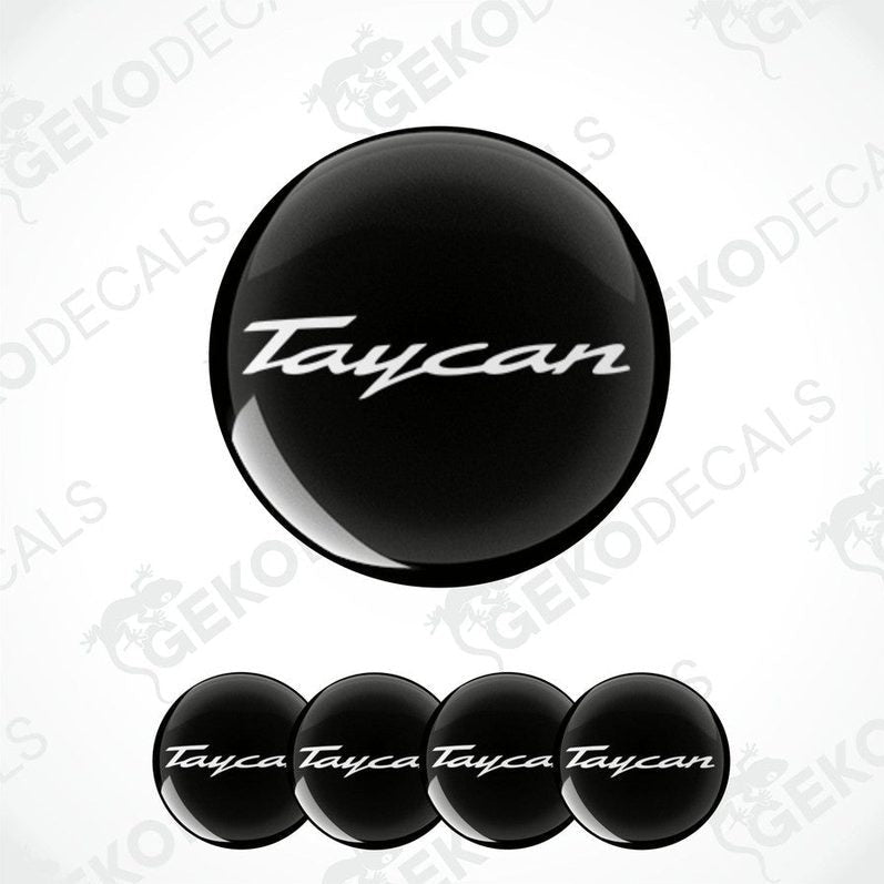 Set of four black round car decals with the text 'Taycan' on them, presented against a white background.