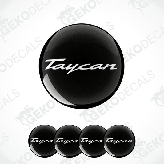 Set of four black round car decals with the text 'Taycan' on them, presented against a white background.