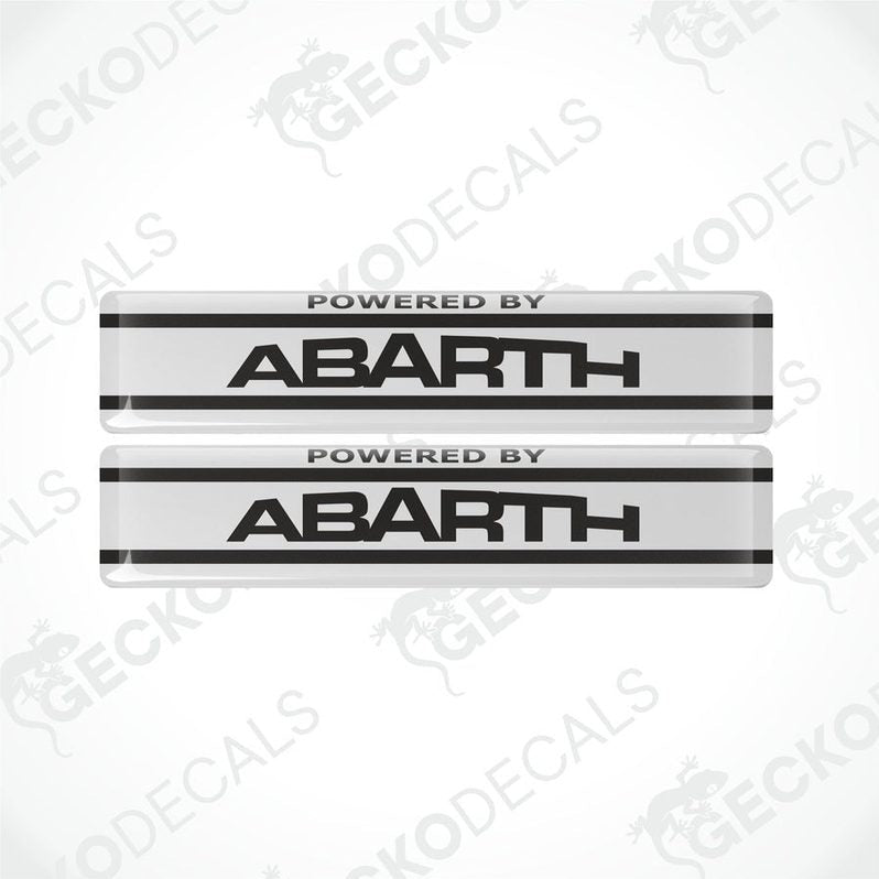 Two white vinyl stickers with the text 'POWERED BY ABARTH' and a logo depicting a stylized 'A' in black on a white background, placed against a white background with 'GECKODECALS' and 'ABARTH' logos.

