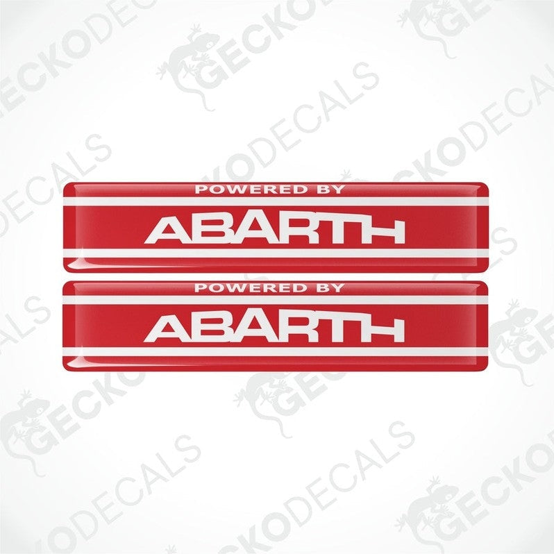 Two red vinyl stickers with the text 'POWERED BY ABARTH' and a logo depicting a stylized 'A' in white on a red background, placed against a white background with 'GECKODECALS' and 'ABARTH' logos.