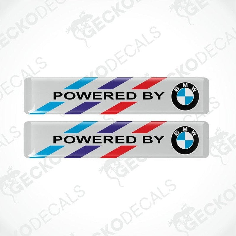Two BMW M LOGO STICKERS on a white background