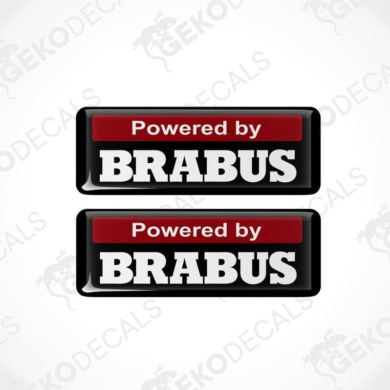 Two black and red vinyl decals with white text that read 'POWERED BY BRABUS.