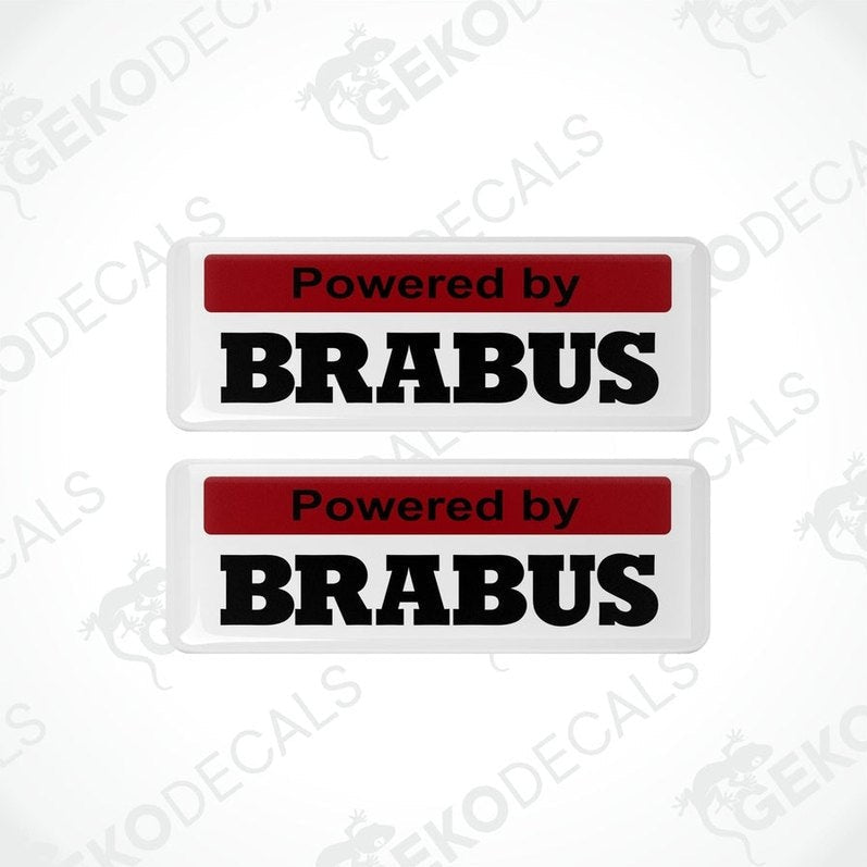 Two white and red vinyl decals with black text that read 'POWERED BY BRABUS.