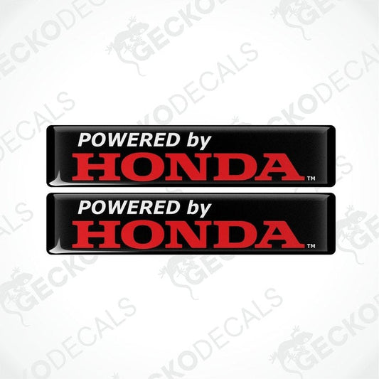 Two black vinyl stickers with the text 'POWERED BY HONDA' in red and white.