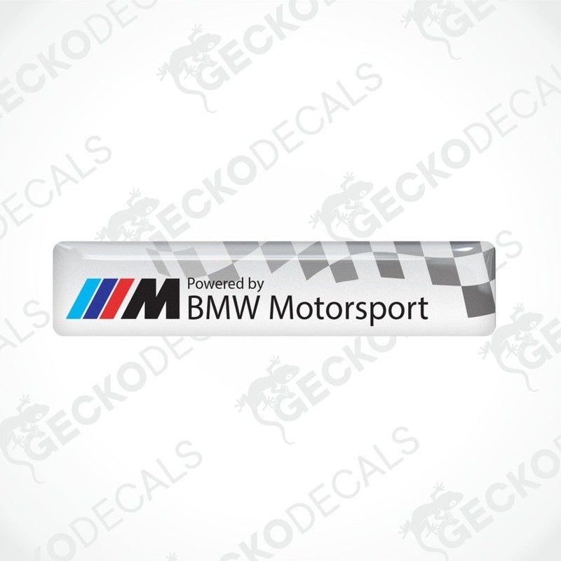 Vinyl stickers with a  POWERED BY BMW M MOTORSPORT  logo, predominantly white with blue and red checkered pattern.