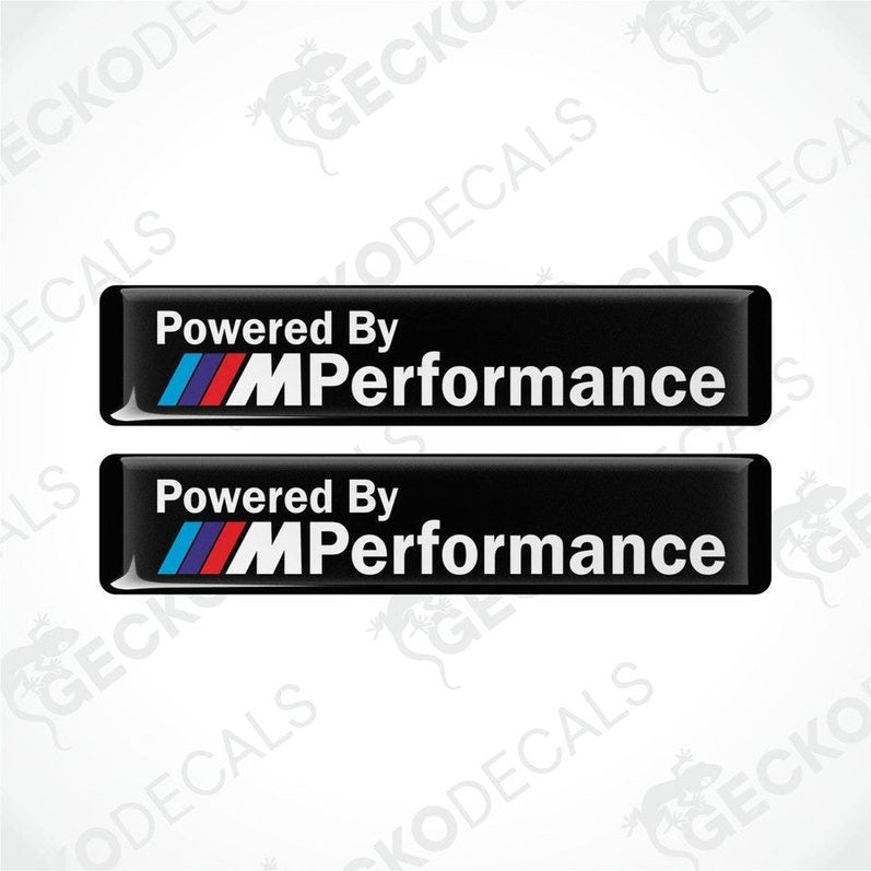 Two black vinyl stickers with the text 'POWERED BY M PERFORMANCE' and the BMW logo.
