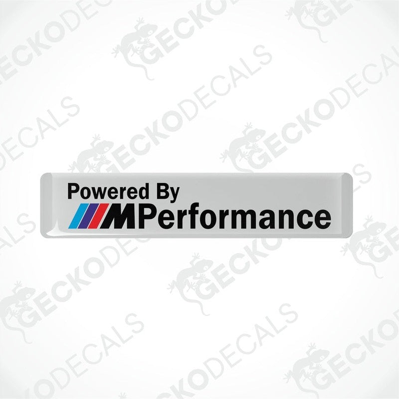 White vinyl stickers with the text 'POWERED BY M PERFORMANCE' and the BMW logo.