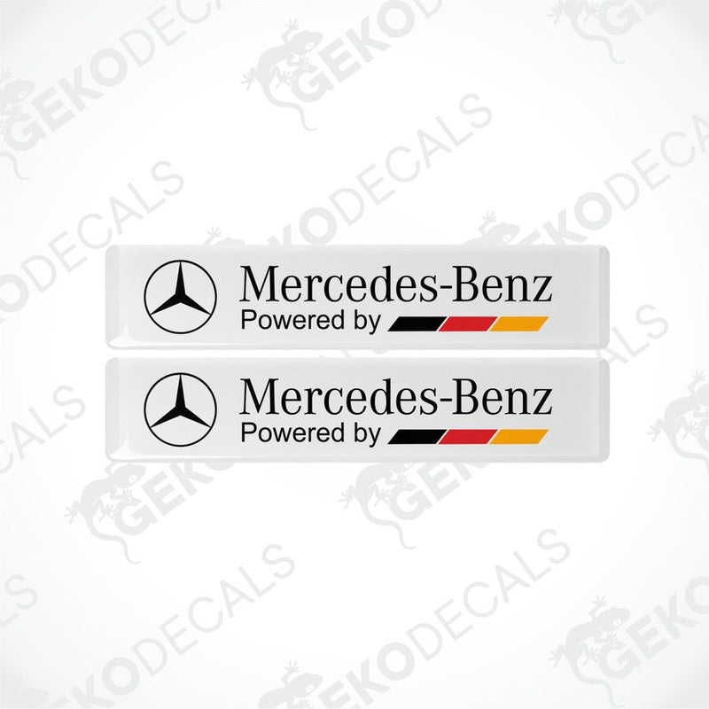 Two withe vinyl decals with the 'Mercedes-Benz Powered by' text in black and red-yellow accents.