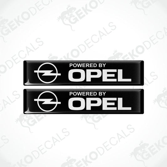 Two black vinyl stickers with the text 'POWERED BY OPEL' and the Opel logo.