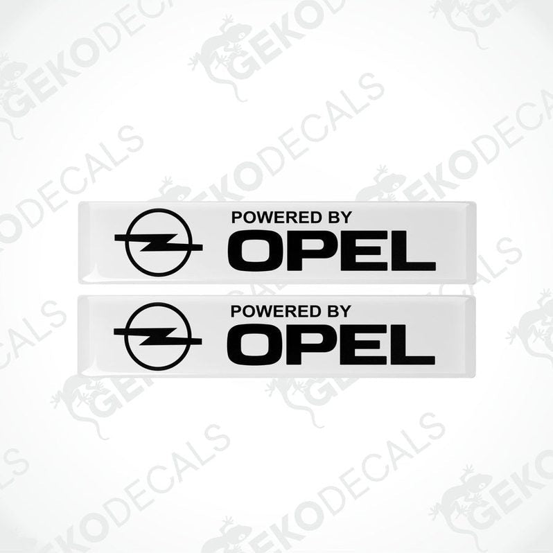Two withe vinyl stickers with the text 'POWERED BY OPEL' and the Opel logo.