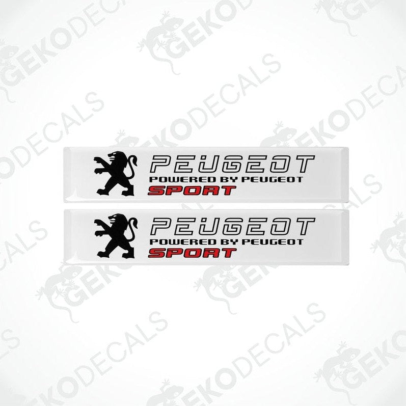 Two withe vinyl stickers with the text 'PEUGEOT POWERED BY PEUGEOT SPORT' and a graphic of a lion.