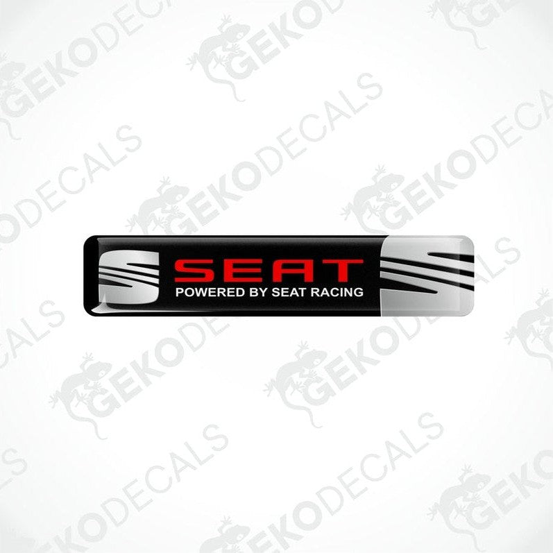Rectangular vinyl decals with a polyurethane coating, featuring the text 'SEAT POWERED BY SEAT RACING' in a black, red, and white color scheme.