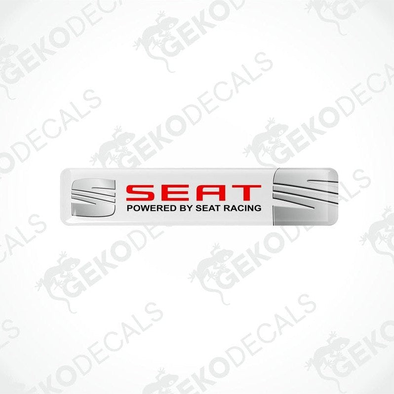 Rectangular vinyl decals with a polyurethane coating, featuring the text 'SEAT POWERED BY SEAT RACING' in a withe, red, and white color scheme.