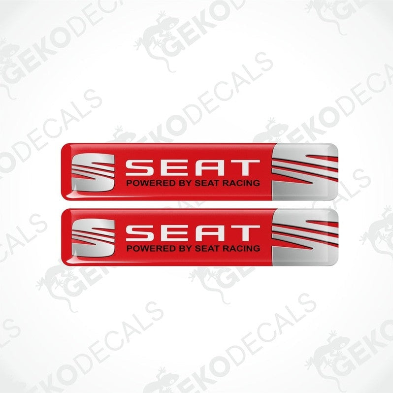 Two rectangular vinyl decals with a polyurethane coating, featuring the text 'SEAT POWERED BY SEAT RACING' in a  red, and white color scheme.