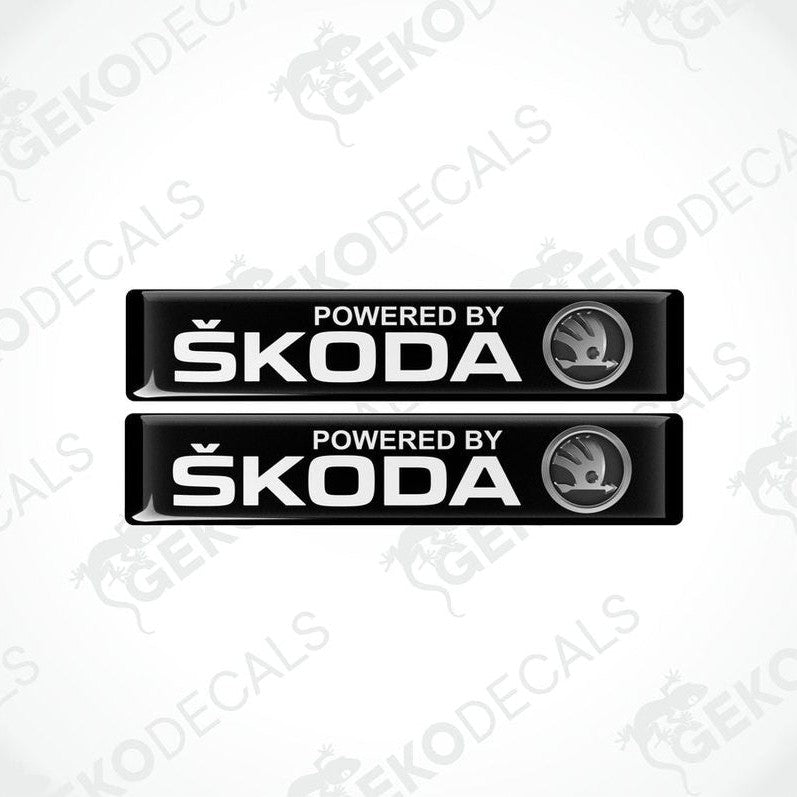 Two black decals with white text and the Skoda logo, labeled 'POWERED BY SKODA'.