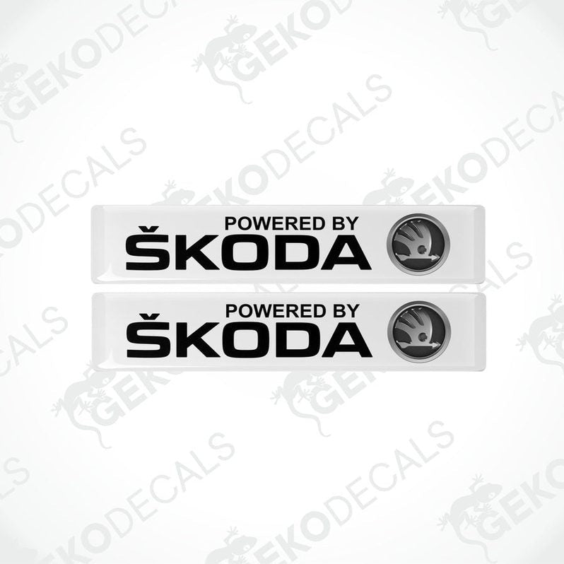 Two withe decals with black text and the Skoda logo, labeled 'POWERED BY SKODA'.