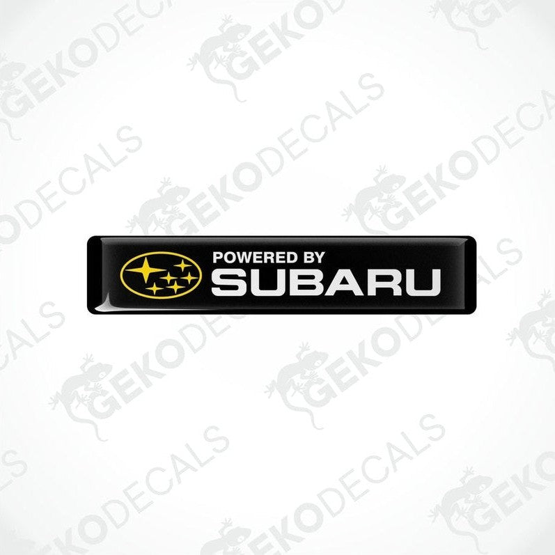 black vinyl stickers with the text 'POWERED BY SUBARU' and the Subaru logo.