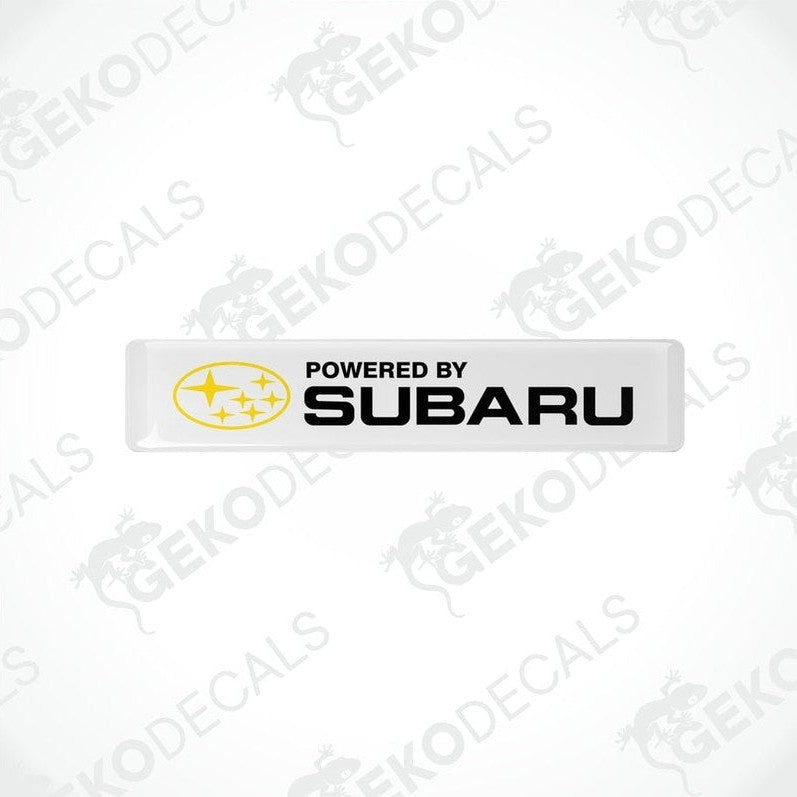 Withe vinyl stickers with the text 'POWERED BY SUBARU' and the Subaru logo.