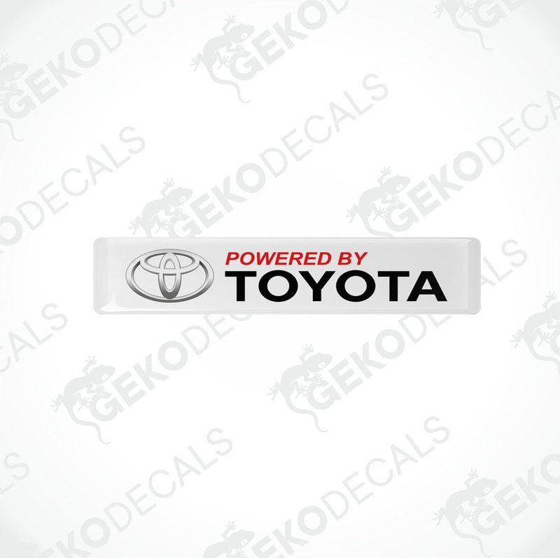 Withe vinyl stickers with the text 'POWERED BY TOYOTA' in red and black Toyota logo.