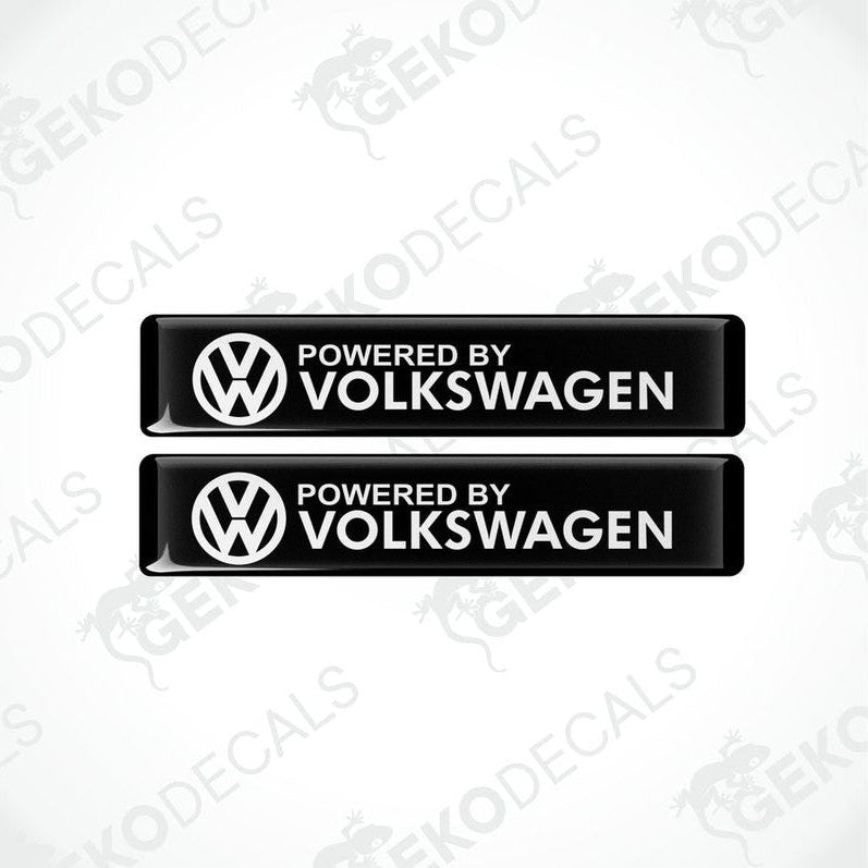 Two black vinyl decals with the white text 'POWERED BY VOLKSWAGEN' and the Volkswagen logo.