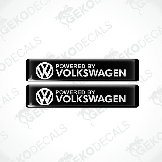 Two black vinyl decals with the white text 'POWERED BY VOLKSWAGEN' and the Volkswagen logo.