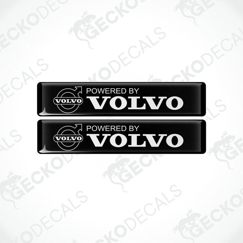 Two black vinyl stickers with the text 'POWERED BY VOLVO' and a Volvo logo.