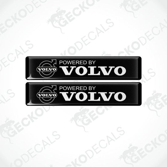 Two black vinyl stickers with the text 'POWERED BY VOLVO' and a Volvo logo.