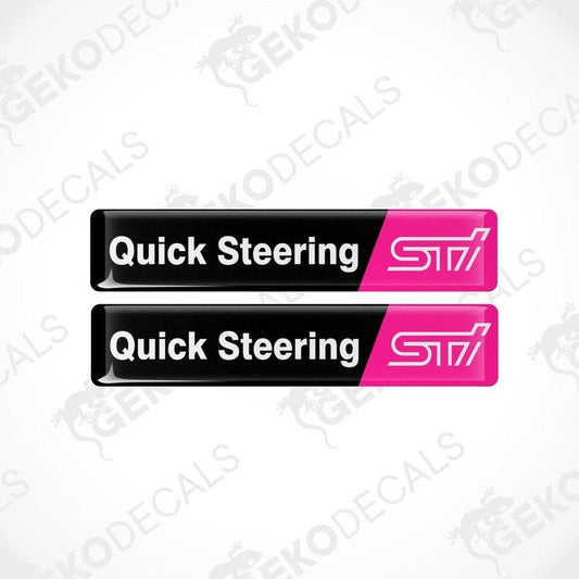 Two black vinyl stickers with the words 'QUICK STEERING' and 'STI' in pink lettering.