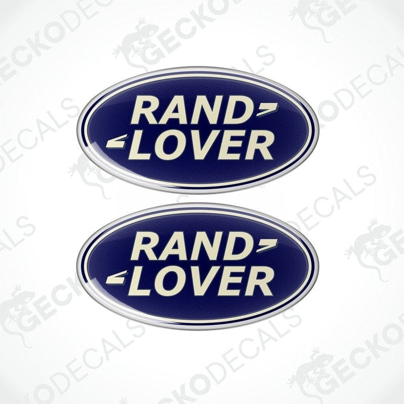 Two blue oval-shaped vinyl decals with the text 'RAND LOVER' in white and silver.

