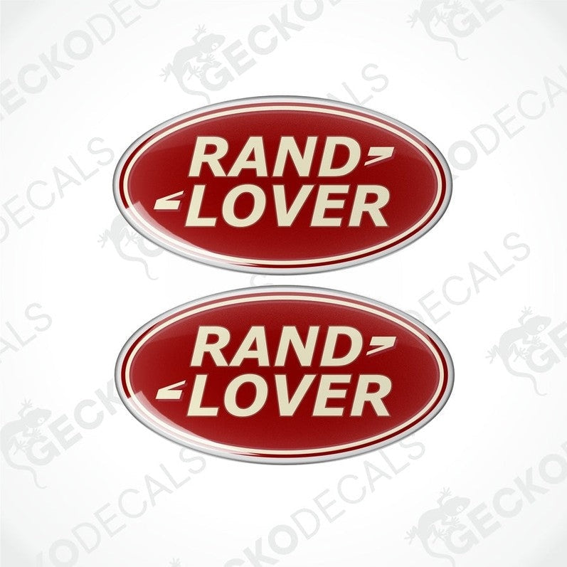Two red oval-shaped vinyl decals with the text 'RAND LOVER' in white and silver.

