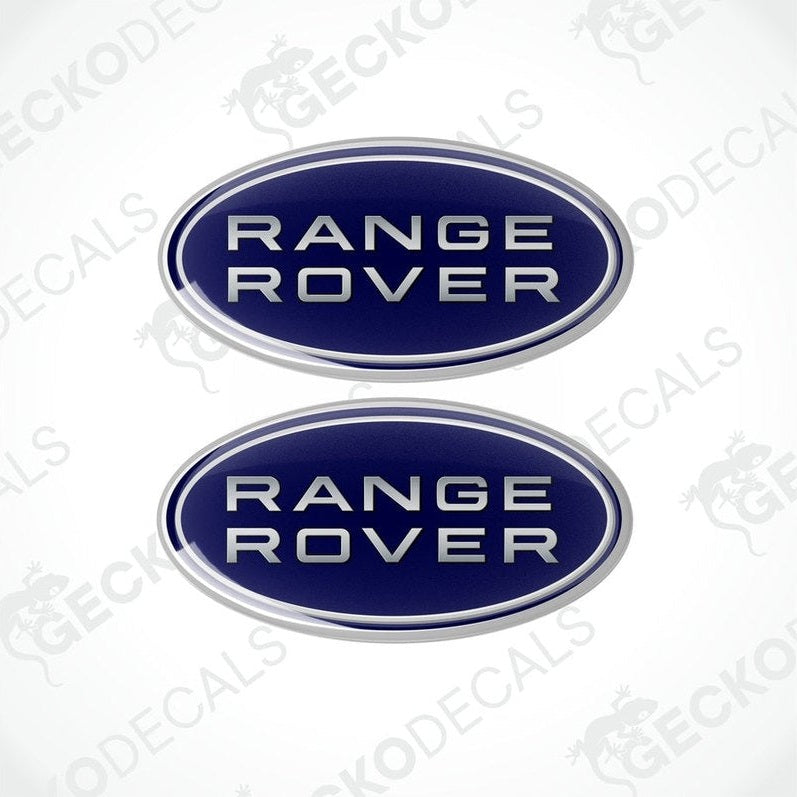 Two oval-shaped blue car decals with the text 'RANGE ROVER' on them.