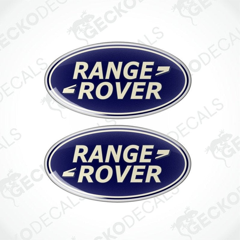 Two blue and silver oval-shaped vinyl decals with 'RANGE ROVER' text in white.