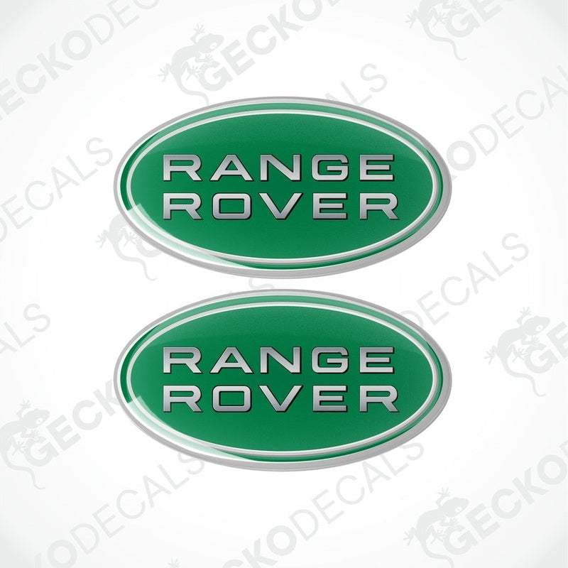 Two oval-shaped green car decals with the text 'RANGE ROVER' on them.