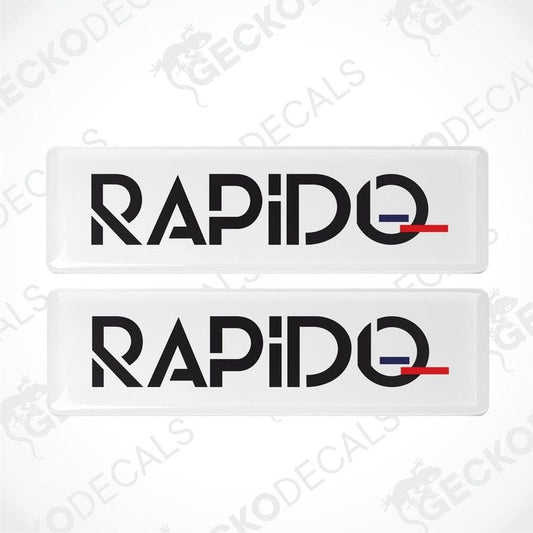 Two white vinyl decals with the word 'RAPIDO' in black and a small red accent on the top of each decal.