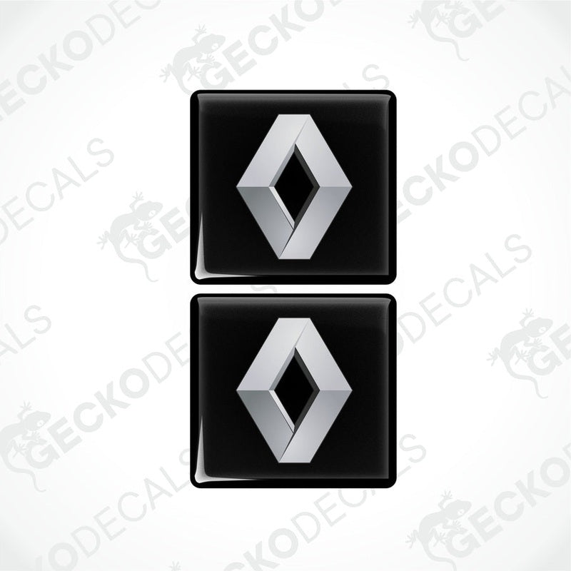 Two black and silver square-shaped decals with the RENAULT logo.