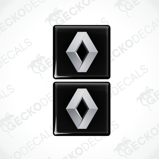 Two black and silver square-shaped decals with the RENAULT logo.
