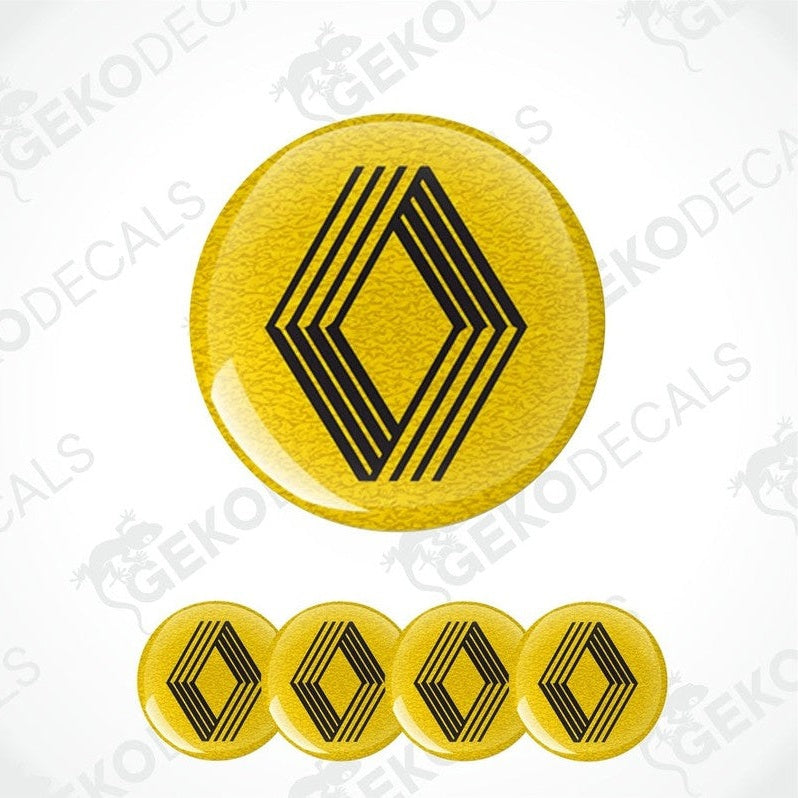 A set of four yellow vinyl decals with black geometric patterns, likely intended for use as car wheel caps or stickers.