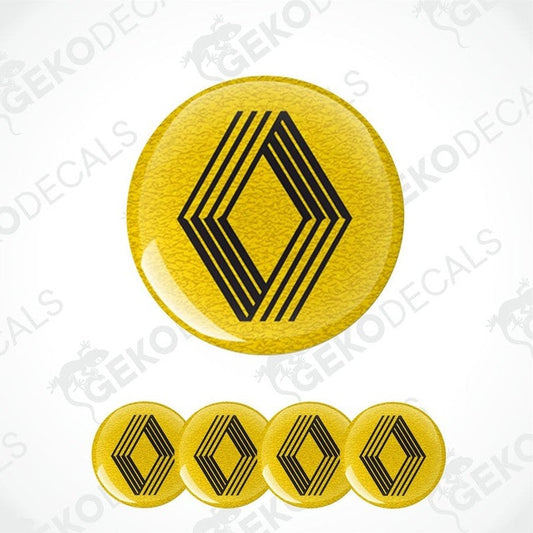 A set of four yellow vinyl decals with black geometric patterns, likely intended for use as car wheel caps or stickers.