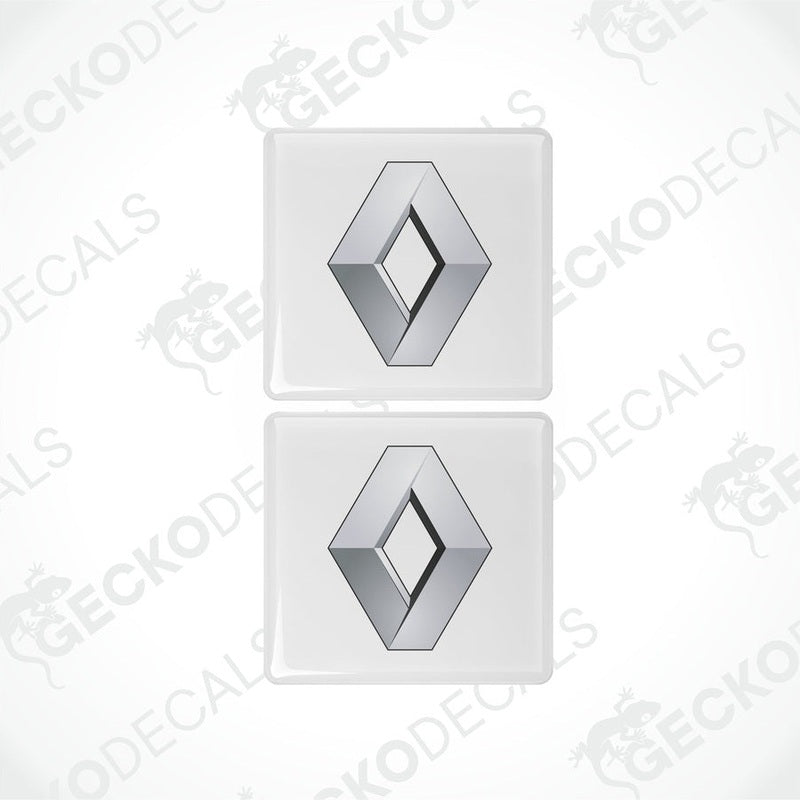 Two withe and silver square-shaped decals with the RENAULT logo.
