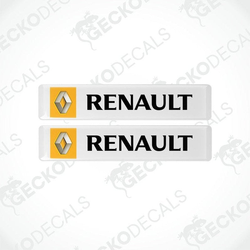 Two withe vinyl stickers with the RENAULT logo in yellow.