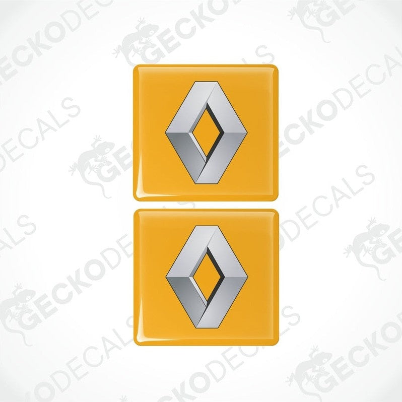 Two yellow and silver square-shaped decals with the RENAULT logo.