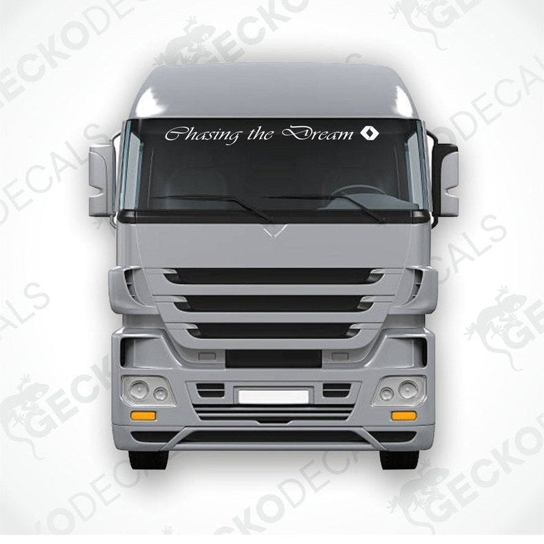 A decal with the text 'Chasing the Dream' positioned on the front windscreen of a gray Renault truck.