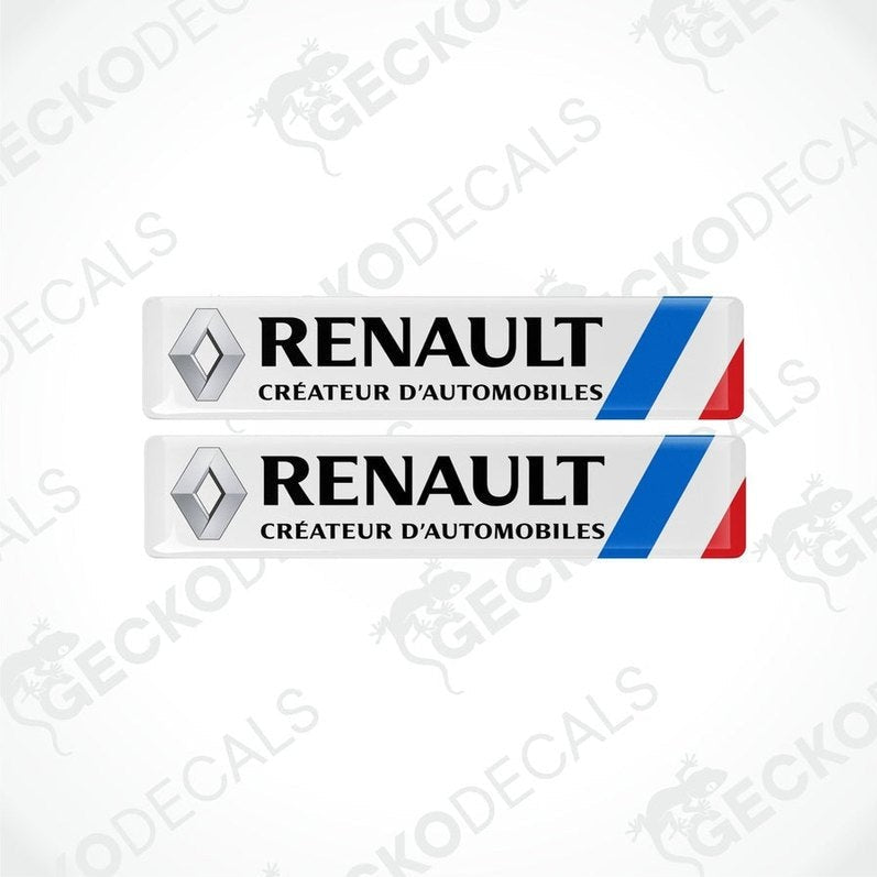 A pair of withe vinyl stickers with the RENAULT RS SPORT logo printed in black.
